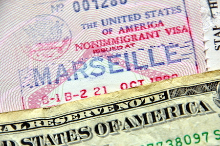 In this photo illustration an american visa stamped on a French passport.
US authorities are suspending the issuance of visas in several countries around the world due to the pandemic of Coronavirus.