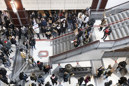 Black Lives Matter activists address a crowd at a sit-in in the Ohio Union in front of an emblematic “O” for the University and their mascot, Brutus the Buckeye during the demonstration.
Ohio State University (OSU) Students staged a sit-in demonstration in reaction to the police shooting and killing of Ma’Khia Bryant, 16, the day before. Activists demanded that The Ohio State University sever ties with the Columbus Police Department to keep their minority students safe.