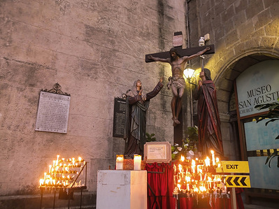 A replica of the crucified Christ with the Virgin Mary and Apostle John during Maundy Thursday. Catholic devotees in the Philippines flock at the San Agustin Church in Intramuros, Manila. One of their rituals is visiting the seven churches or "Visita Iglesia." It commemorates Jesus Christ's Institution of the Eucharist during the Last Supper with His Apostles.