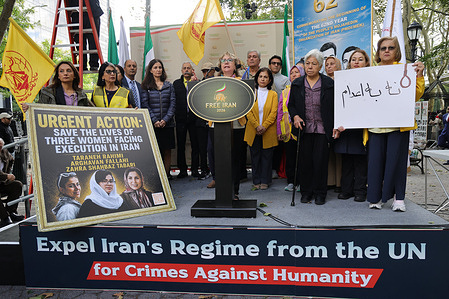 A former Iranian political prisoner addresses the crowd from a central podium. Thousands of Iranian-Americans and supporters of the National Council of Resistance of Iran (NCRI) assembled at Dag Hammarskjöld Plaza outside the United Nations Headquarters to protest against the Iranian regime president's address to the UN General Assembly. Prominent American political figures and international dignitaries joined demonstrators to condemn human rights violations and rising executions in Iran, explicitly rejecting both theocratic dictatorship and monarchical rule.