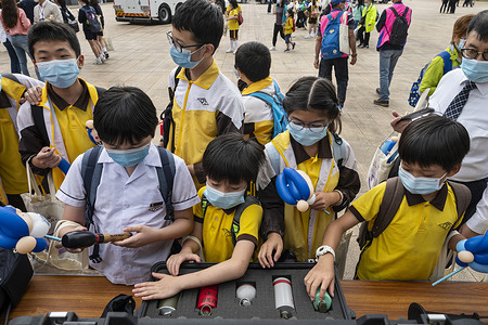 School children engage in a weapon display during the National Security Education Day at the Hong Kong Police College in Hong Kong, China of April 15, 2020. The former British colony is holding its first National Security Education Day.