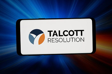 In this photo illustration, the logo of US insurance company Talcott Financial Group is displayed on a smartphone in front of abstract background on computer screen.