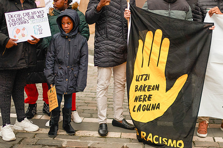 A protester holds a placard during the demonstration. On the occasion of the International Day Against Racism and Xenophobia, a rally was held in Pamplona denouncing "institutionalized racism". A statement was read stating that undocumented foreigners have no access to housing or free healthcare, as well as against the hate speech promoted by certain political representatives.