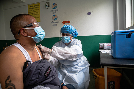 A man reacts while taking a jab of Janseen ( American Covid-19 vaccine) at the municipality hospital in Mulpani.
People aged between 50-54 are vaccinated till July 21 which includes disabled, sanitation workers and foreign migrant workers from Nepal where this American Vaccine is being approved by the particular country. Nepal received 1.634 million doses of J & J vaccine from the US on July 12th, through COVAX, an international vaccine sharing scheme.