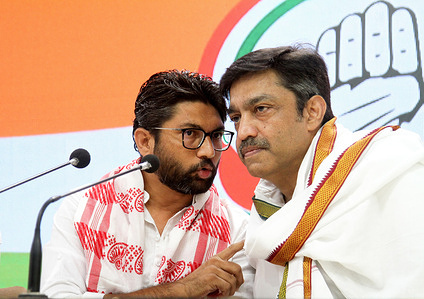 Gujrat independent MLA (Member of Legislative Assembly) Jignesh Mevani (L) along with congress party member Rajesh Lilothia (R) address to the media during a press conference at the Indian National Congress party headquarter in New Delhi. After he was released on bail over two cases filed on April 20, 2022 and April 25, 2022 in Assam State. He told the media it was pre planned conspiracy to destroy him and also slammed the central Prime Minister Narendra Modi's government.