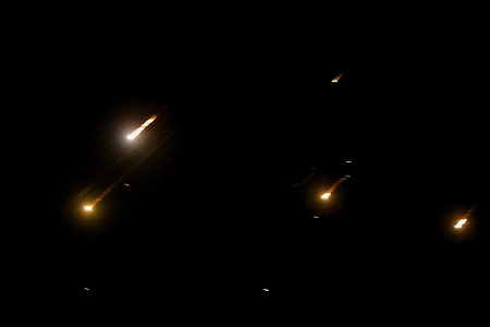 Rockets fired from Iran are seen at night over the sky in the occupied West Bank. Israel and Iran exchanged fire; days after Israel launched an unprecedented airstrike campaign that Iran said struck its nuclear facilities, "martyred" senior commanders, and killed dozens of civilians.