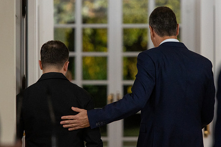 Spanish Prime Minister Pedro Sánchez (R) and President of Ukraine, Volodymyr Zelensky (L), say goodbye after their meeting at the Moncloa Palace.