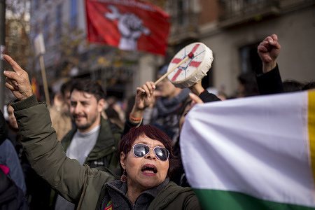 A protester shouts slogans and holds a flag representing the indigenous peoples of Latin America during a demonstration in front of the US Embassy, against the US military operation that ousted Venezuelan leader Nicolas Maduro from the country.