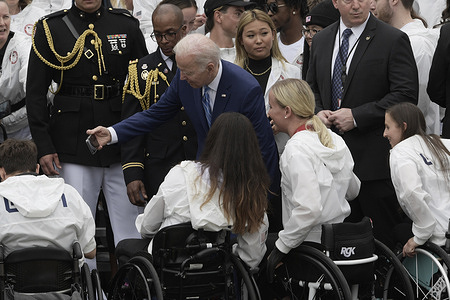 President Joe Biden takes a selfie with members of Team USA during a welcoming ceremony of Team USA to White House at South Lawn/White House in Washington DC, USA.
