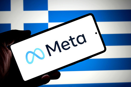 In this photo illustration, a Meta logo is seen displayed on a smartphone with the flag of Greece in the background.