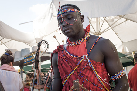 An African man with traditional clothes seen at the festival.
Africans living in Greece, at a festival with traditional African food and dances. They also were selling traditional clothes and jewels.