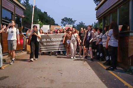 Women hold a banner and placards expressing their opinion during the demonstration. Women's organizations and university students protested in front of Bogazici University after a 15-year-old girl called Hilal Ozdemir was murdered by a 24-year-old man called Ayberk Kurtulus. The murder was committed during a wedding at a rented space at Bogazici University, one of Turkey's oldest universities.