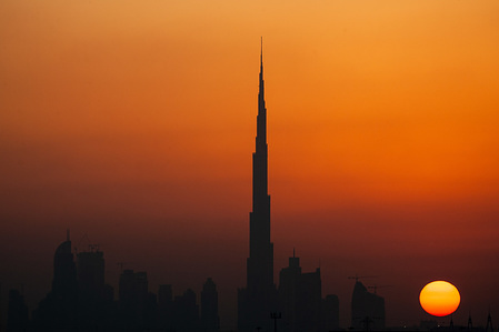 Silhouette of the Burj Khalifa building, the world's tallest structure, also known as the Burj Dubai silhouettes seen during sunset.