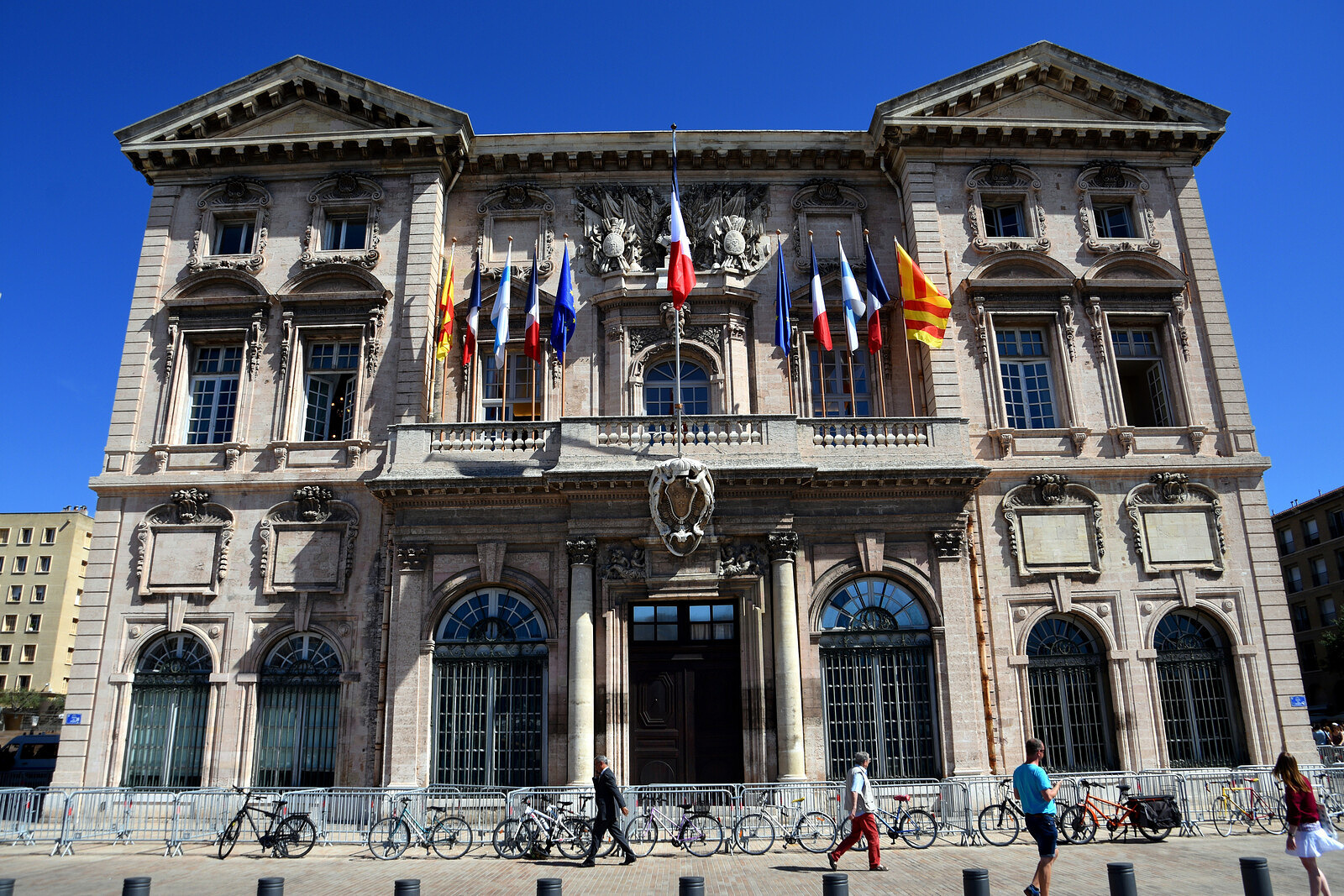 Facade of the Marseille town hall with flags.