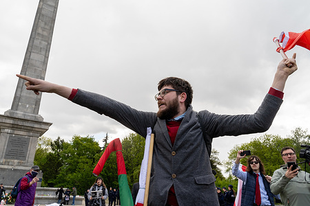 A man waves a Soviet Union flag as he takes part in the 80th anniversary of Victory Day and the end of WWII in Europe. On May 9, dozens of Ukrainian activists gathered at the Soviet Military Cemetery to protest against the presence of Russian officials marking Victory Day. Russia’s Ambassador to Poland, Sergei Andreyev along with his delegation laid a wreath at the monument commemorating Soviet soldiers who died during World War II. The event was disrupted by demonstrators expressing opposition to Russia’s ongoing aggression in Ukraine. Victory Day celebrated on May 9 in Russia honors the Soviet Union’s triumph over Nazi Germany in 1945.