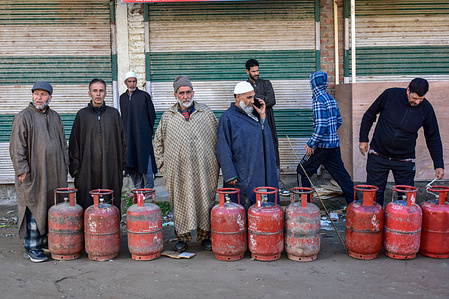 Kashmiri residents queue up to refill their empty LPG gas cylinders at a gas agency, amid supply crisis in the country, in Budgam, about 30kms from Srinagar, the summer capital of Jammu and Kashmir. India faces significant gas supply challenges due to conflict in the Middle East. The closure of the Strait of Hormuz has tightened global gas supplies, escalating costs and affecting several key sectors within India.
