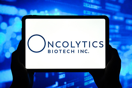 In this photo illustration, the logo of Oncolytics Biotech Inc. is displayed on the screen of a smart tablet.