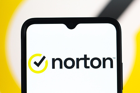 In this photo illustration, the Norton logo is seen displayed on a smartphone screen.