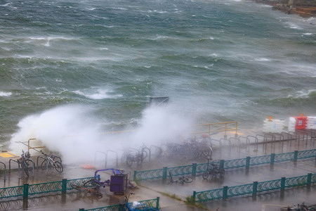 Phenomenal swells drove seawater high onto the pavement caused by extremely strong winds from Typhoon Wipha in Hong Kong. Hong Kong issued its highest tropical cyclone warning on July 20 as Typhoon Wipha battered the city, with authorities cancelling classes and grounding hundreds of flights
