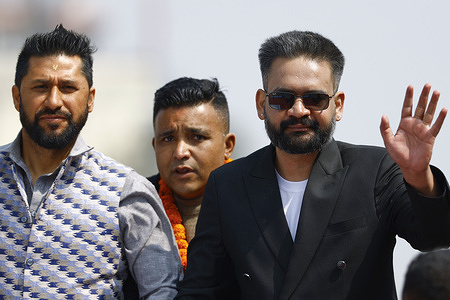 Prime ministerial candidate Balen Shah (right), along with the chairman Rabi Lamichhane of the Rastriya Swatantra Party (RSP), whose election symbol is the bell, take part in a campaign rally ahead of the upcoming elections in Kathmandu.