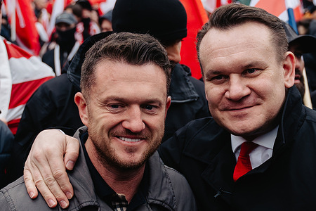 (L-R) Tommy Robinson and Dominik Tarczynski, a Member of the European Parliament from the Law and Justice party, participate during the march. Poland celebrates National Independence Day, marking the nation’s regained sovereignty in 1918 after 123 years of partition. On the 107th anniversary, Catholic and right-wing groups organized an independence march through the streets of Warsaw. For the past 16 years, the nationalist and right-wing Independence March Association has led the event. This year’s march, held under the slogan *“One Nation – Strong Poland,”* focused heavily on migration, portraying it as a threat to national unity.
