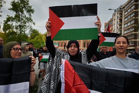 An Arab protester holds a Palestinian flag during the demonstration. Hundreds of protesters gathered in Pamplona in solidarity with Palestine in the recent conflict between Hamas and Israel. On Oct 7, the Palestinian militant group Hamas launched an attack on Israel, prompting Israeli retaliation in Gaza. This Israel-Hamas conflict has resulted in a death toll of more than 3,500 people.