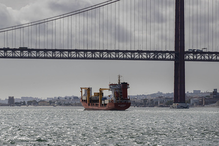 A cargo ship seen sailing near the 25 de Abril Bridge on the Tejo River. Navigation along the Tejo River remains one of the most emblematic elements of Lisbon and Portugal's landscape. The river traffic ranging from tourist boats to recreational craft, cargo ships and cruise liners shows how modernity and tradition coexist in the country's capital.