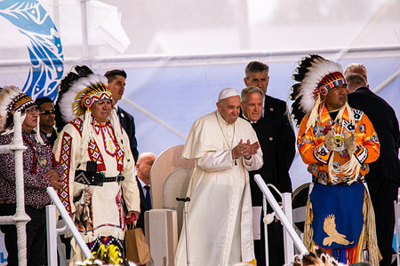 Pope Francis watches the Drum Circle and Singers during the Honor Song. Pope Francis' journey of healing, reconciliation and hope. His first act was not to gather with the faithful for Mass but, rather to gather his strength to make this first stop, which signals the importance of why he has come to Canada - to encounter First Nations, Métis and Inuit peoples on their traditional territories.