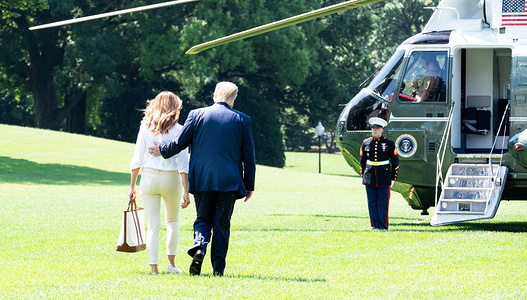 President Donald Trump and First Lady Melania Trump on the South Lawn of the White House as they are about to leave on Marine One for the weekend, in Washington, DC.