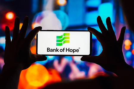 In this photo illustration, the Bank of Hope logo is displayed on a smartphone screen.
