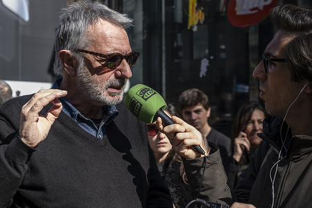 The artist Frederic Amat, author of the famous drawing of the name of Barcelona where the letter L has been replaced by a bow is seen during the ceremony.

Unveiling of the memorial inscription in memory of the victims of the attack on La Rambla which occurred on August 17, 2017 when a van drove into the center of the promenade causing numerous casualties and injuries. The memorial includes one of the phrases selected from the thousands of messages of solidarity expressed by the citizenship: Peace be upon you, oh city of peace.orial includes one of the phrases selected from the thousands of messages of solidarity expressed by the citizenship: Peace be upon you, oh city of peace.