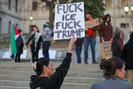 (EDITORS NOTE: Image contains profanity) Anti-ICE demonstrators hold placards on the steps of the Pennsylvania Capitol during the rally. The protest was in response to the killing of Renee Nicole Good by federal agents in Minneapolis on the previous day.