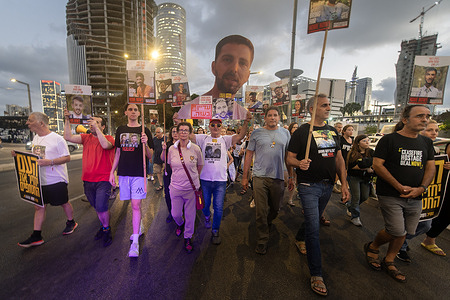Families of hostages Yocheved Lifshitz and Ohad Ben Ami march, calling to end the war. Thousands of people demonstrate and marched around the Kirya base where the Israeli cabinet will meet to decide on a plan to continue the war and the occupation of the Gaza Strip. They demonstrators called for the release of the hostages and an end to the war.