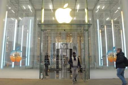 People exit an Apple store on Fifth Avenue in Manhattan, New York City.