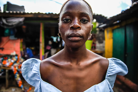 22-Year-Old model Catherine Atieno poses wearing her outfit designed by Afrowema for the Just Fashion Day in Nairobi. The Just Fashion Day of Eco Fashion Week Kenya highlighted collections of sustainable outfits created through collaborations involving Afrowema ethical fashion brand, Kibera's local tailors, and Seeds&Stories enterprise, incorporating both new and recycled materials. This event strongly advocated for sustainable practices in the fashion industry, emphasized inclusivity, and demonstrated a commitment to healing the planet. It served as a platform to showcase the progression towards a more eco-friendly and equitable local fashion industry.