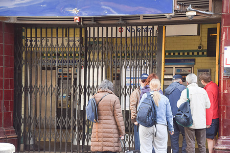 Commuters stand outside a closed Russell Square station as London Underground drivers, represented by RMT (National Union of Rail, Maritime and Transport Workers) begin their strike over the proposal to allow train operators to shift to a compressed four-day week.