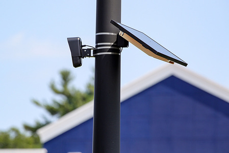 A Flock automated license plate reader (ALPR) camera is seen at the parking lot of a Lowe’s store near Bloomsburg.