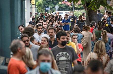 Brazilian citizens wait in line on general election day at a polling station in Belo Horizonte, Minas Gerais State Capital.