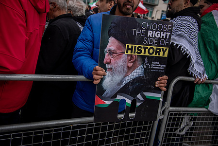 A protestor holds a placard during the Al Quds Day Rally. Around 15,000 people defied the British government and hostile policing to turn out for Al-Quds Day in London. The static demonstration was a resounding success, drawing a bigger attendance than normal in response to a government ban on the annual procession. The event lived up to its claims of inclusivity with people of all faiths and backgrounds coming together to call for justice for the Palestinians. Rabbis, pastors, imams, women and many children were among people from all walks of life to take part.