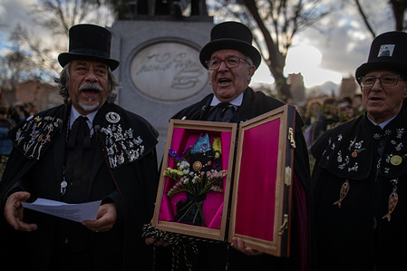 Members of the Merry Brotherhood of the Burial of the Sardine carry a small coffin with a sardine. during the traditional Burial of the Sardine of the Madrid Carnival, performed by members of the Merry Brotherhood of the Burial of the Sardine to mark the end of the festivities in the capital.
