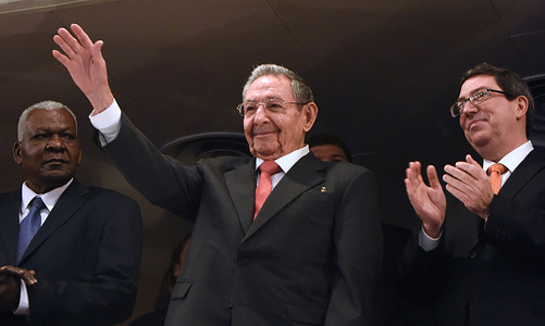 Former Cuban president Raul Castro waves to the audience at the Gran Teatro de la Habana Alicia Alonso prior to an address to the Cuban people by U.S. President Barack Obama.