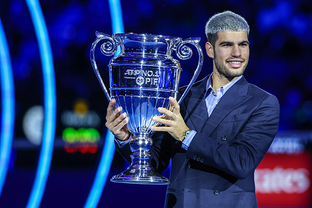Carlos Alcaraz of Spain holds the 2025 Year-End ATP World No.1 Trophy presented by PIF during day six of the Nitto ATP Finals 2025 at Inalpi Arena in Turin