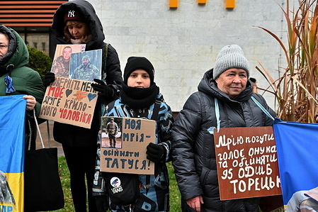 Protesters hold placards during the demonstration. Ukrainians continue to participate in the 'Free Azov' rallies in support of the captured defenders of Mariupol, which regularly take place in Kyiv and other Ukrainian cities. The participants took to the streets to remind the society that the Ukrainian military has been in Russian captivity since 2022.