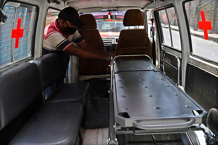 Mechanics fix a stretcher bed in a car that is being converted into an ambulance with an oxygen cylinder in Bengaluru.
An initiative by "Drive Without Borders" spearheaded by Wasim Memon to help those in need during the second wave of the pandemic is converting 5 Maruthi Omnis into ambulances with oxygen support and 1 into a hearse van. This service is free of charge.
