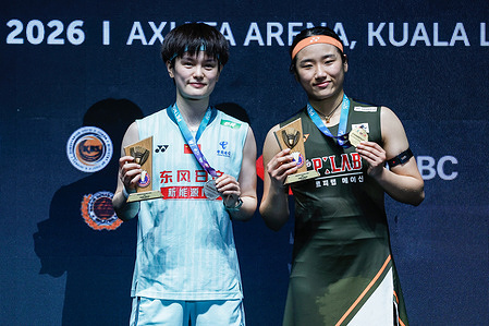 An Se Young of Korea (R) and Wang Zhi Yi of China pose with the medal on the podium after the Women's Singles Final match of the Petronas Malaysia Open 2026 at Axiata Arena. An Se Young won with scores; 21/24 : 15/22.