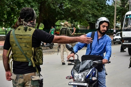 A member of Special Operation Group (SOG) seen pulling over a motorcyclist.
Frisk operations by government forces after recent attacks in the summer capital, Srinagar where a policeman was killed and one injured.