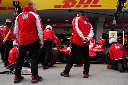 Aston Martin mechanic works inside garage ahead of the Chinese Formula One Grand Prix race at the Shanghai International Circuit.