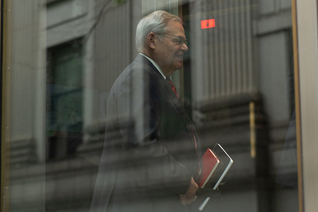 Democratic Senator Bob Menendez waits in line at the Manhattan federal court in New York. Senator Menendez and his wife Nadine and three New Jersey businessmen are accused of bribery scheme, including conspiracy to commit bribery, conspiracy to commit honest services fraud and conspiracy to commit extortion under color of official right.