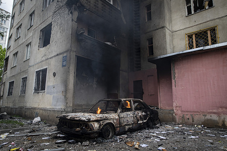 A car on fire after being hit by a Russian artillery strike in Saltivka. Kharkiv, the second biggest city in Ukraine, is under constant threat of Russian bombardment and airstrikes. Russia invaded Ukraine on 24 February 2022, triggering the largest military attack in Europe since World War II.
