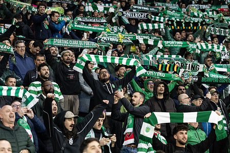 Sporting CP fans hold scarves during the UEFA Champions League quarter-final 1st leg match between Sporting CP and Arsenal FC at Estadio de Alvalade Stadium. Final score; Sporting CP 0-1 Arsenal FC